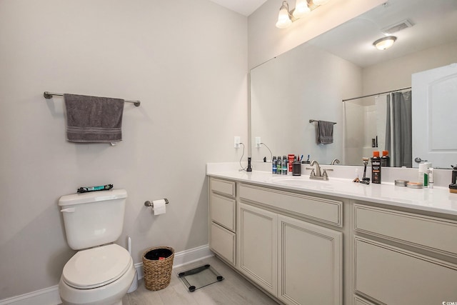 150 Ella Kinley Cir Unit 301, Myrtle Beach, SC 29588 - bathroom featuring vanity, toilet, baseboards, and a shower with curtain