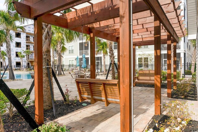 150 Ella Kinley Cir Unit 301, Myrtle Beach, SC 29588 - view of patio / terrace with a pergola and a community pool