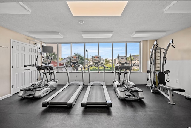 1625 S Ocean Blvd Unit 309, North Myrtle Beach, SC 29582 - gym featuring a textured ceiling and baseboards