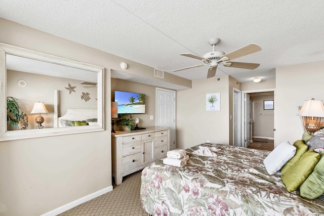 1625 S Ocean Blvd Unit 309, North Myrtle Beach, SC 29582 - bedroom featuring light carpet, baseboards, a textured ceiling, and ceiling fan