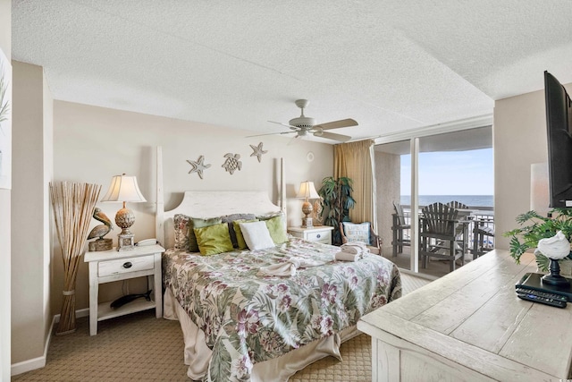 1625 S Ocean Blvd Unit 309, North Myrtle Beach, SC 29582 - carpeted bedroom featuring access to outside, a textured ceiling, floor to ceiling windows, and ceiling fan
