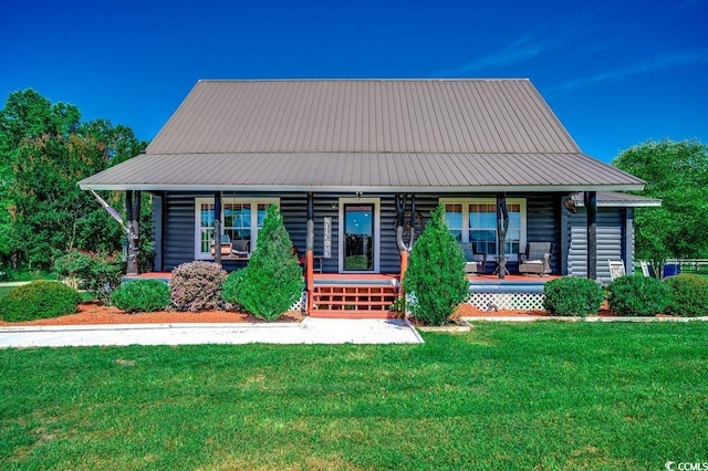 181 Halfway Rd, Nichols, SC 29581 - view of front of house featuring a porch, a front yard, and log veneer siding