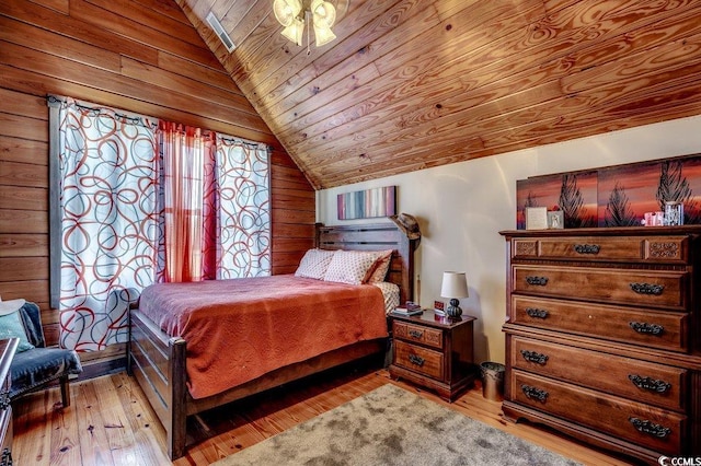 181 Halfway Rd, Nichols, SC 29581 - bedroom with lofted ceiling, wooden ceiling, light wood-type flooring, and wood walls
