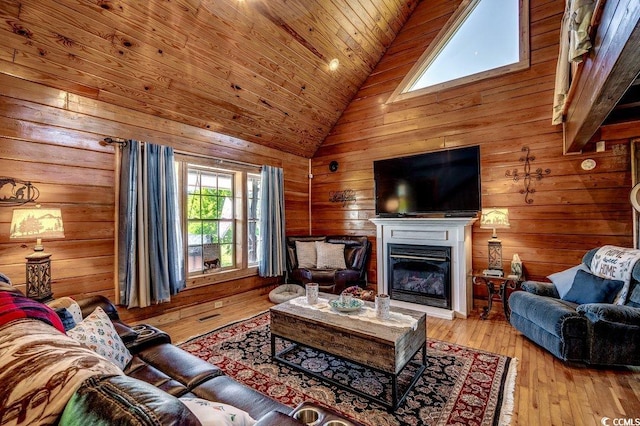 181 Halfway Rd, Nichols, SC 29581 - living room featuring wooden walls, wood ceiling, a fireplace, high vaulted ceiling, and hardwood / wood-style floors