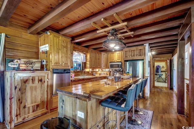 181 Halfway Rd, Nichols, SC 29581 - kitchen with appliances with stainless steel finishes, a sink, wood ceiling with exposed beams, a kitchen island, and light wood finished floors