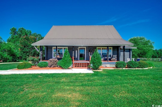 181 Halfway Rd, Nichols, SC 29581 - view of front of home with covered porch, a front lawn, and metal roof
