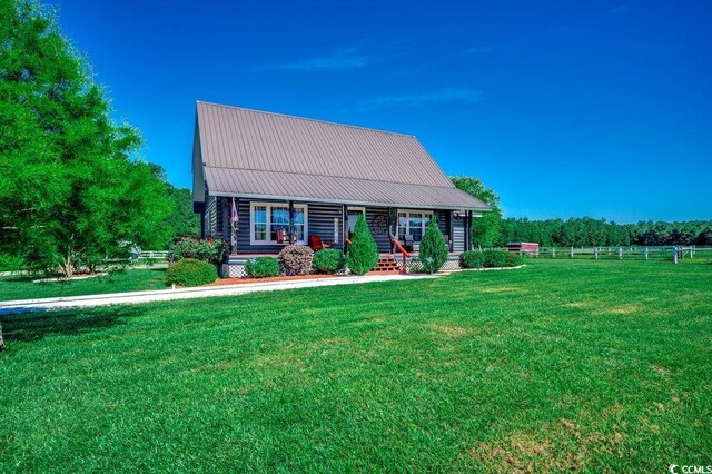 181 Halfway Rd, Nichols, SC 29581 - log cabin with a porch, metal roof, and log siding