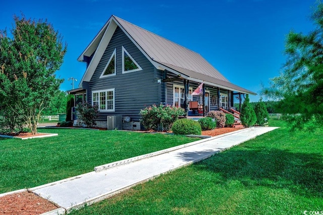 181 Halfway Rd, Nichols, SC 29581 - view of home's exterior with covered porch, a lawn, metal roof, and central AC unit