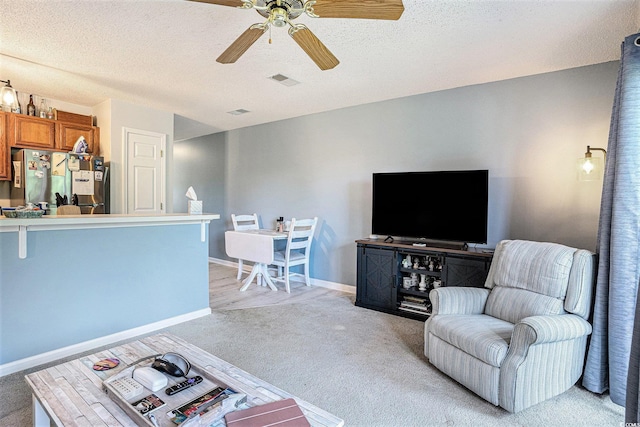 1460 Blue Tree Ct Unit E, Myrtle Beach, SC 29588 - living area featuring a ceiling fan, light colored carpet, and a textured ceiling
