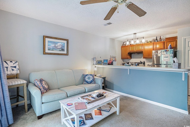 1460 Blue Tree Ct Unit E, Myrtle Beach, SC 29588 - living room featuring light carpet, ceiling fan, and a textured ceiling