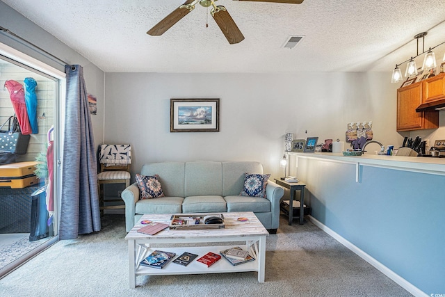 1460 Blue Tree Ct Unit E, Myrtle Beach, SC 29588 - living area with ceiling fan, light colored carpet, and a textured ceiling