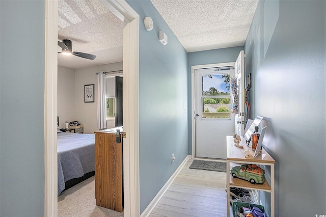 1460 Blue Tree Ct Unit E, Myrtle Beach, SC 29588 - corridor featuring a textured ceiling and wood finished floors