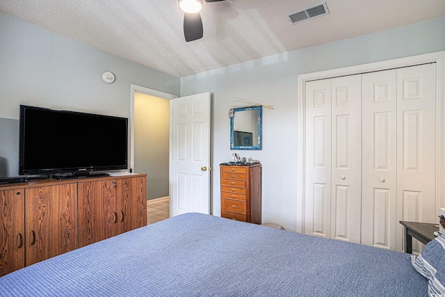 1460 Blue Tree Ct Unit E, Myrtle Beach, SC 29588 - bedroom featuring a closet, ceiling fan, and a textured ceiling