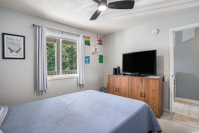 1460 Blue Tree Ct Unit E, Myrtle Beach, SC 29588 - carpeted bedroom with a textured ceiling and ceiling fan