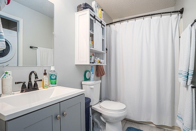 1460 Blue Tree Ct Unit E, Myrtle Beach, SC 29588 - bathroom featuring washer / dryer, a textured ceiling, vanity, and curtained shower