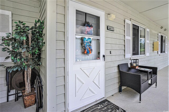 1460 Blue Tree Ct Unit E, Myrtle Beach, SC 29588 - view of exterior entry featuring a porch