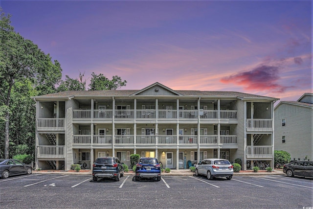 1460 Blue Tree Ct Unit E, Myrtle Beach, SC 29588 - property at dusk featuring uncovered parking