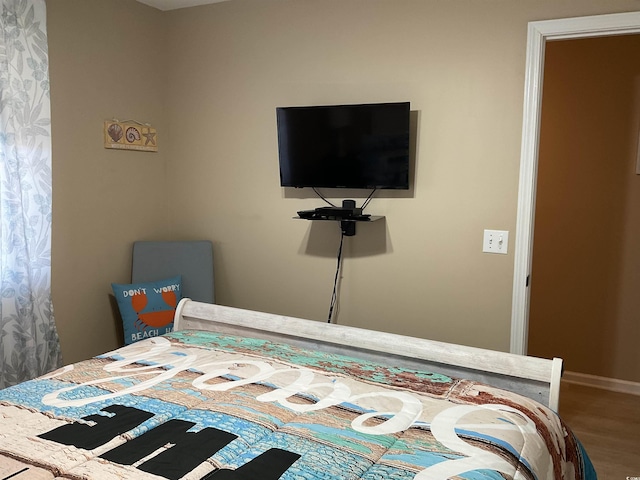 1900 Duffy St Unit L-5, North Myrtle Beach, SC 29582 - bedroom featuring wood finished floors and baseboards