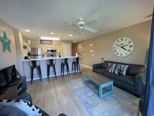 1900 Duffy St Unit L-5, North Myrtle Beach, SC 29582 - living room featuring a ceiling fan, light wood-type flooring, baseboards, and recessed lighting