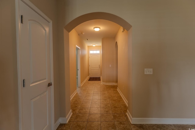 1224 Checkerberry St, Longs, SC 29568 - hallway with arched walkways, baseboards, and tile patterned flooring