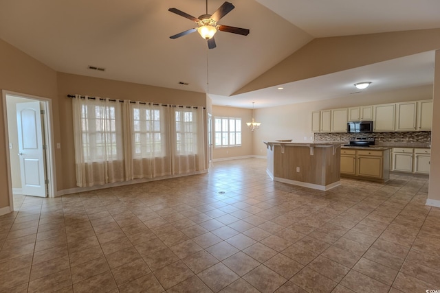 1224 Checkerberry St, Longs, SC 29568 - kitchen with open floor plan, lofted ceiling, light tile patterned flooring, range, and backsplash