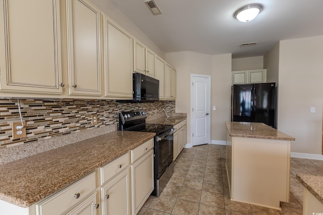 1224 Checkerberry St, Longs, SC 29568 - kitchen featuring black appliances, cream cabinets, a kitchen island, and decorative backsplash
