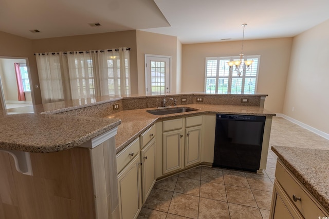 1224 Checkerberry St, Longs, SC 29568 - kitchen with black dishwasher, a sink, cream cabinetry, light tile patterned floors, and light stone countertops