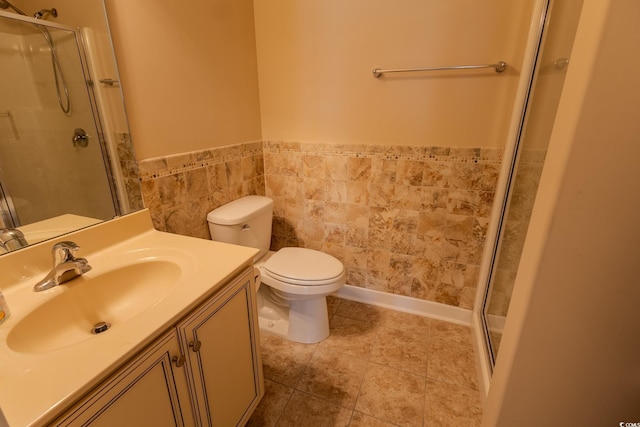 1224 Checkerberry St, Longs, SC 29568 - full bathroom featuring a stall shower, toilet, vanity, a wainscoted wall, and tile walls