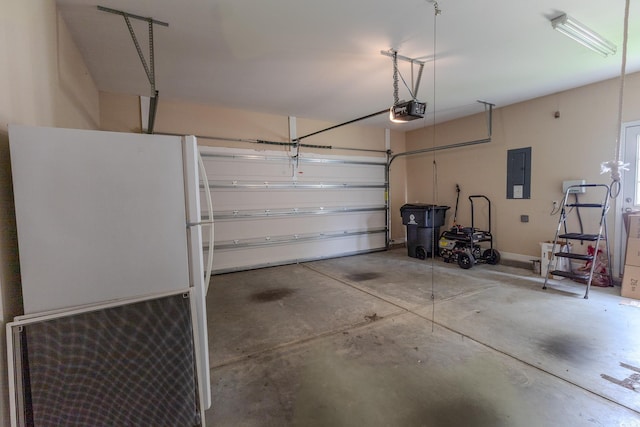 1224 Checkerberry St, Longs, SC 29568 - garage featuring freestanding refrigerator, electric panel, and a garage door opener