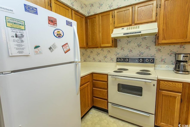 305 N Hillside Dr Unit 206, North Myrtle Beach, SC 29582 - kitchen featuring white appliances, under cabinet range hood, wallpapered walls, light countertops, and brown cabinetry