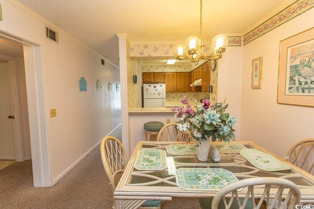 305 N Hillside Dr Unit 206, North Myrtle Beach, SC 29582 - dining room with ornamental molding, a chandelier, and carpet flooring