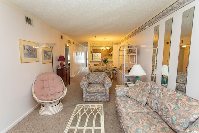 305 N Hillside Dr Unit 206, North Myrtle Beach, SC 29582 - living room featuring a textured ceiling, a chandelier, ornamental molding, and carpet flooring