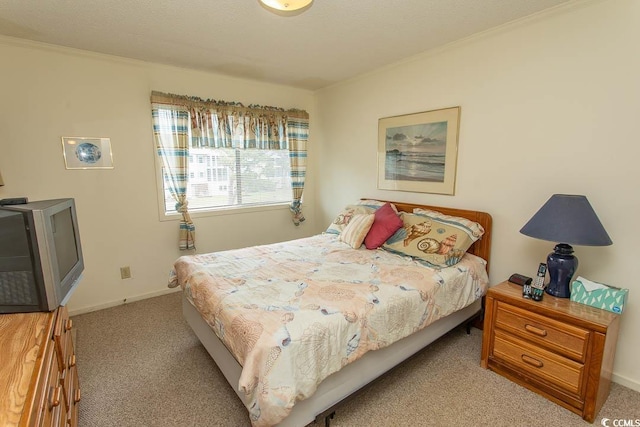 305 N Hillside Dr Unit 206, North Myrtle Beach, SC 29582 - carpeted bedroom featuring ornamental molding and baseboards