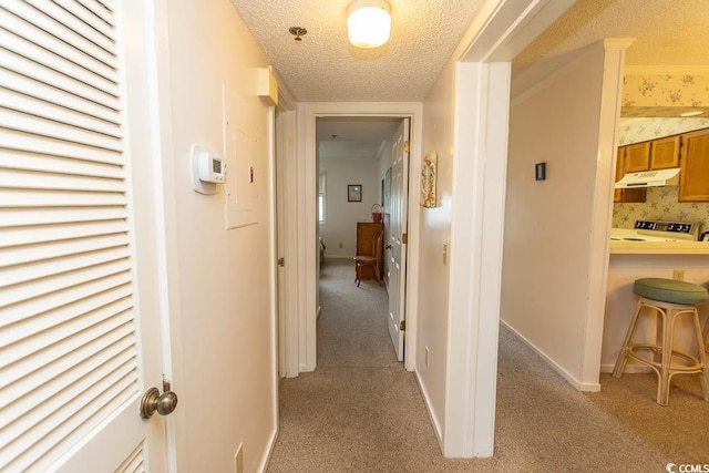 305 N Hillside Dr Unit 206, North Myrtle Beach, SC 29582 - hall with a textured ceiling and light carpet
