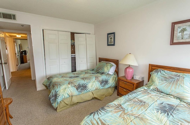 305 N Hillside Dr Unit 206, North Myrtle Beach, SC 29582 - bedroom featuring light colored carpet, crown molding, a closet, and a textured ceiling