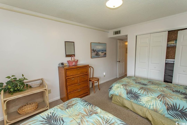 305 N Hillside Dr Unit 206, North Myrtle Beach, SC 29582 - carpeted bedroom featuring ornamental molding, a closet, and a textured ceiling