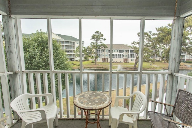 305 N Hillside Dr Unit 206, North Myrtle Beach, SC 29582 - sunroom with a water view