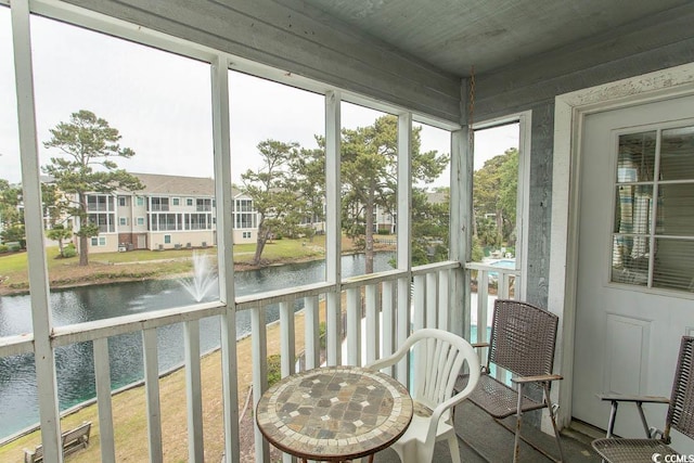 305 N Hillside Dr Unit 206, North Myrtle Beach, SC 29582 - sunroom with a water view