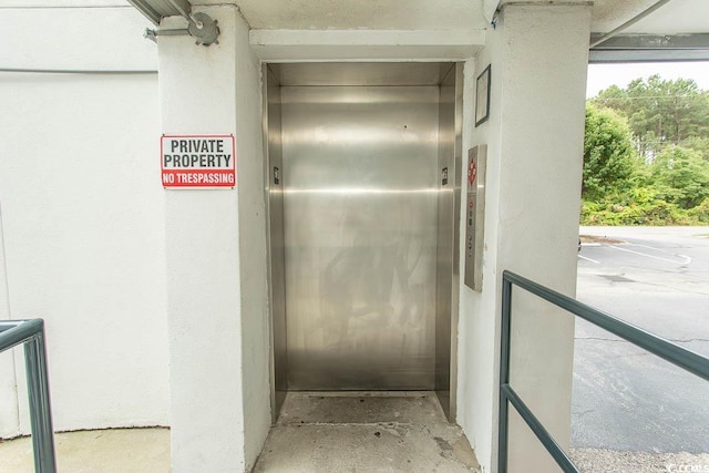 305 N Hillside Dr Unit 206, North Myrtle Beach, SC 29582 - elevator featuring stucco siding