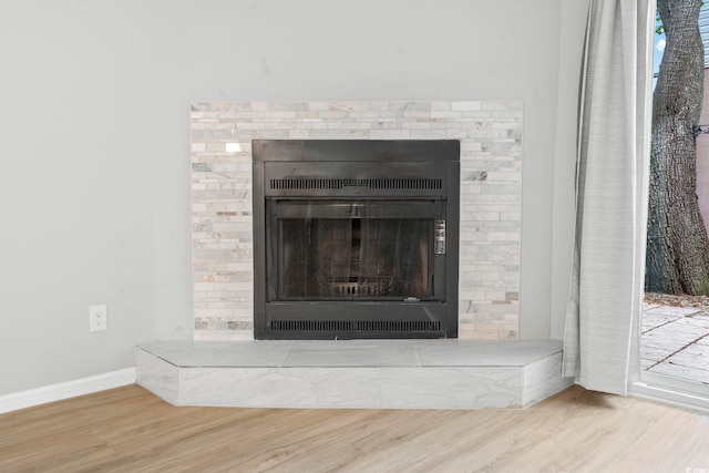 6703 Jefferson Pl Unit B7, Myrtle Beach, SC 29572 - detailed view of wood finished floors and a fireplace with raised hearth
