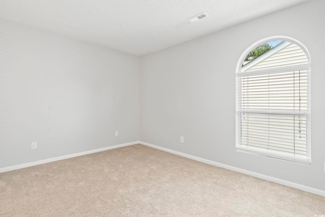 6703 Jefferson Pl Unit B7, Myrtle Beach, SC 29572 - carpeted spare room featuring baseboards and a textured ceiling
