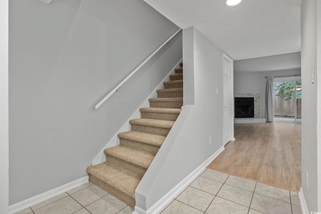 6703 Jefferson Pl Unit B7, Myrtle Beach, SC 29572 - stairway with tile patterned flooring, a fireplace with raised hearth, and recessed lighting