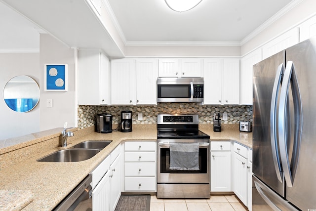 208 Ocean Blvd N Unit 226, North Myrtle Beach, SC 29582 - kitchen featuring stainless steel appliances, ornamental molding, tasteful backsplash, and white cabinetry