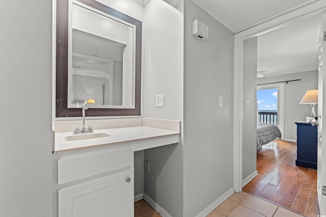 208 Ocean Blvd N Unit 226, North Myrtle Beach, SC 29582 - bathroom featuring vanity, crown molding, and tile patterned flooring