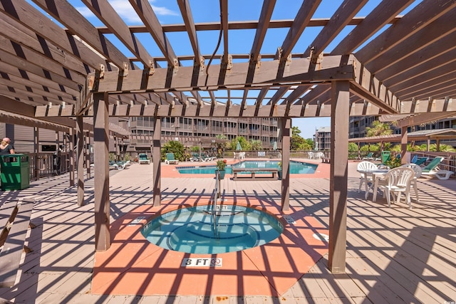 208 Ocean Blvd N Unit 226, North Myrtle Beach, SC 29582 - view of patio / terrace with a community hot tub, a pergola, and a community pool