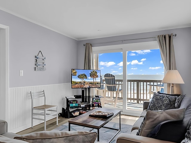 1310 N Waccamaw Dr Unit 208, Garden City Beach, SC 29576 - living room with wood finished floors, ornamental molding, and a wainscoted wall