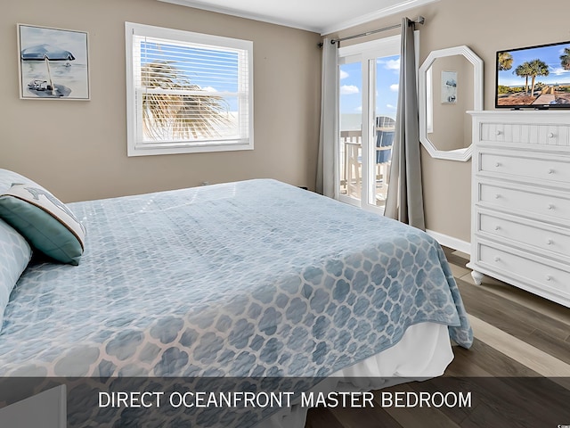 1310 N Waccamaw Dr Unit 208, Garden City Beach, SC 29576 - bedroom with dark wood-style floors, ornamental molding, multiple windows, access to exterior, and baseboards