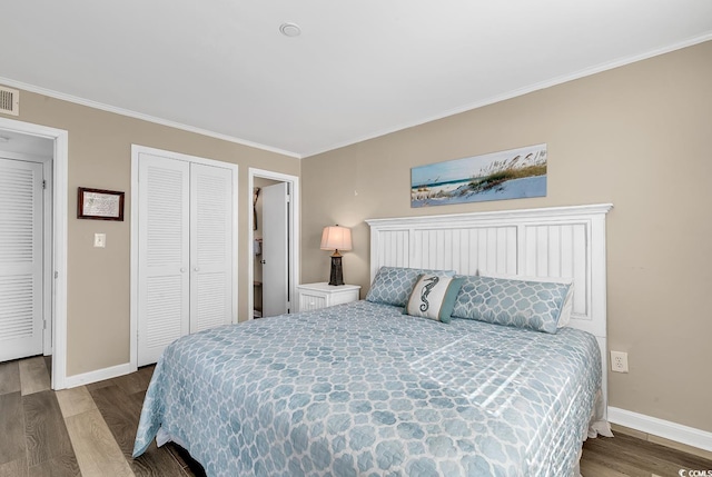 1310 N Waccamaw Dr Unit 208, Garden City Beach, SC 29576 - bedroom with baseboards, wood finished floors, ornamental molding, and a closet