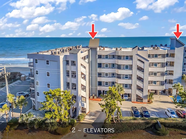 1310 N Waccamaw Dr Unit 208, Garden City Beach, SC 29576 - view of apartment building / complex with a water view