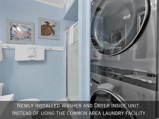 1310 N Waccamaw Dr Unit 208, Garden City Beach, SC 29576 - laundry room with stacked washer and clothes dryer and ornamental molding
